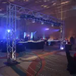 Corporate event lounge with lighting truss, uplighting and seating areas